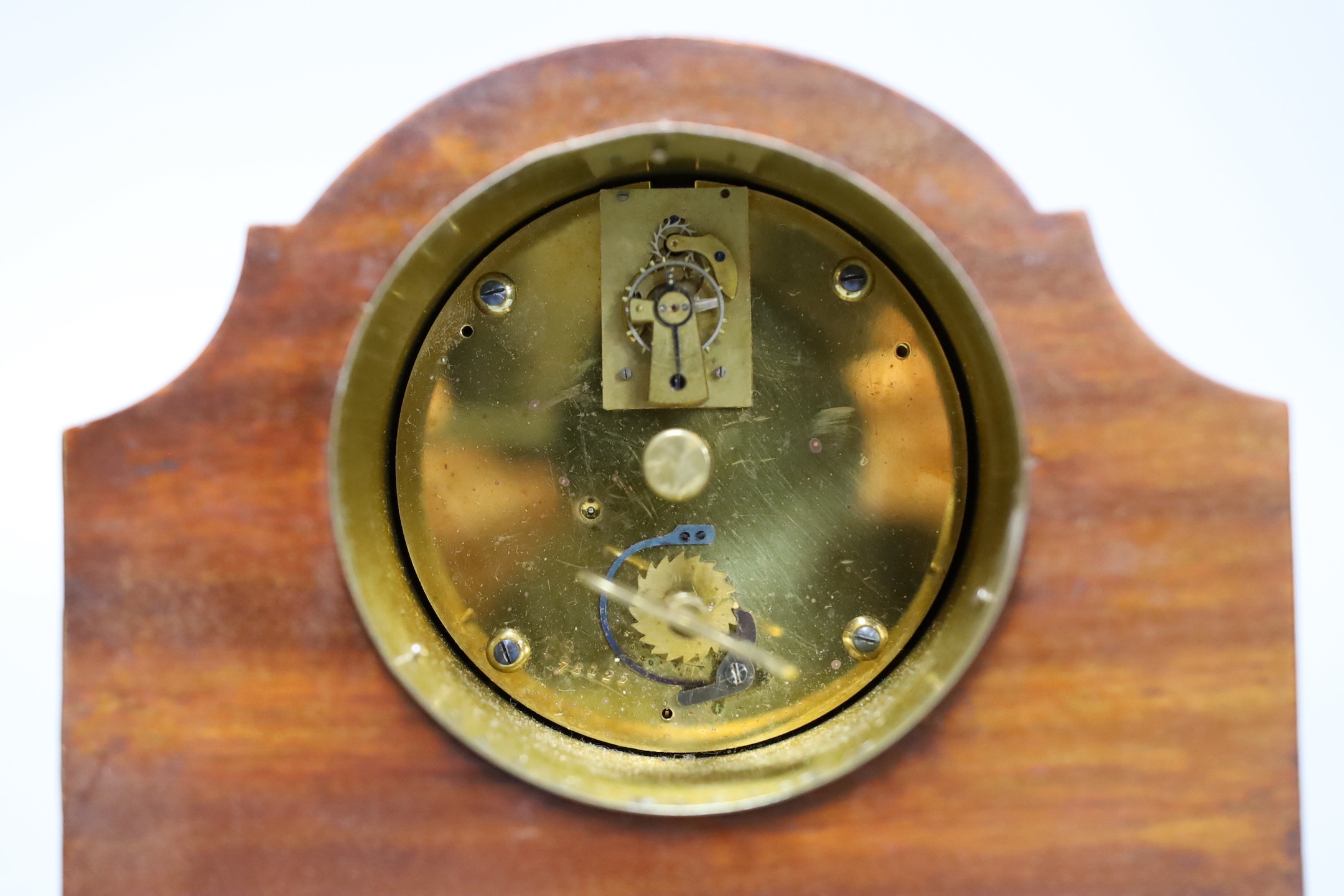 A Victorian walnut and marquetry tea caddy and an inlaid mahogany mantel timepiece, box 20 cms wide 13 cms high